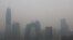 FILE - Beijing's landmark buildings are seen during a polluted day in Beijing, China, Nov. 18, 2016. 