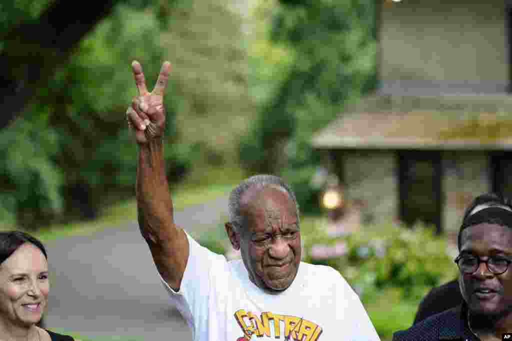 Bill Cosby gestures outside his home in Elkins Park, Pa., June 30, 2021, after being released from prison. Pennsylvania&#39;s highest court has overturned comedian Cosby&#39;s sex assault conviction.