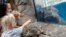 In this Tuesday, June 26, 2018, photo, Fiona, a baby Nile Hippopotamus sleeps as visitors stop by her enclosure at the Cincinnati Zoo & Botanical Garden in Cincinnati.