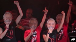 Artists wearing masks depicting former Brazilian President Luiz Inacio da Silva perform at the Lula Free festival in Rio de Janeiro, Brazil, July 28, 2018. The Workers’ Party named the jailed former president as its nominee for president in October’s election.