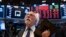Trader Peter Tuchman works on the floor of the New York Stock Exchange Monday, March 16, 2020. (AP Photo/Craig Ruttle)