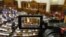 The rostrum of Ukraine's parliament is seen through a reporter's camera monitor in Kyiv, Sept. 17, 2015.