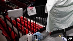 Disinfectant spray sits near television cameras inside a basketball arena at ESPN Wide World of Sports Complex July 29, 2020, in Orlando, Fla. NBA games resume July 30. 