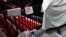 Disinfectant spray sits near television cameras inside a basketball arena at ESPN Wide World of Sports Complex July 29, 2020, in Orlando, Fla. NBA games resume July 30. 
