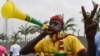 FILE - A Mali supporter gestures and blows a vuvuzela horn upon the arrival of Mali's team at Malabo airport, Jan. 16, 2015, ahead of the 2015 Africa Cup of Nations football tournament.