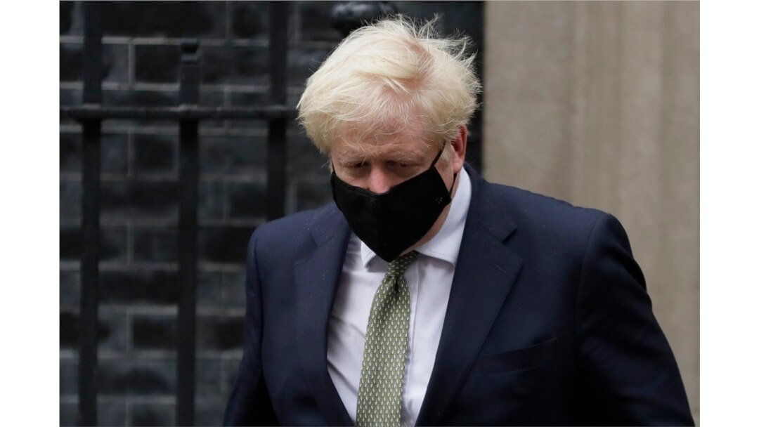 FILE - Britain's Prime Minister Boris Johnson leaves Downing Street to attend parliament in London, Oct. 12, 2020.