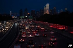 FILE - Vehicles travel along Interstate-30 in Dallas on Nov. 27, 2023. On Thursday, June 27, 2024, the U.S. Census Bureau released population estimates that showed Texas leading all states in new Hispanic, Asian and Black residents added last year. (AP Photo/Julio Cortez, File)