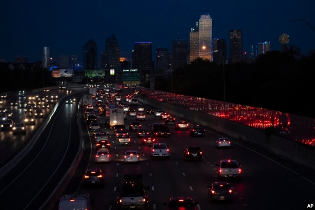 FILE - Vehicles travel along Interstate-30 in Dallas on Nov. 27, 2023. On Thursday, June 27, 2024, the U.S. Census Bureau released population estimates that showed Texas leading all states in new Hispanic, Asian and Black residents added last year. (AP Photo/Julio Cortez, File)