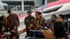 FILE - Indonesian President Joko Widodo answers journalists questions during the inauguration of the Jakarta-Bandung high-speed train named 'Whoosh' at Padalarang station in Padalarang, West Java on Oct. 2, 2023.