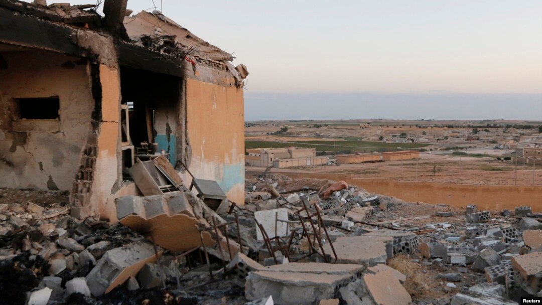 A general view shows a damaged school that was targeted on Monday by what activists said were U.S.-led air strikes, at Ain al-Arous town in Raqqa governorate, October 1, 2014.