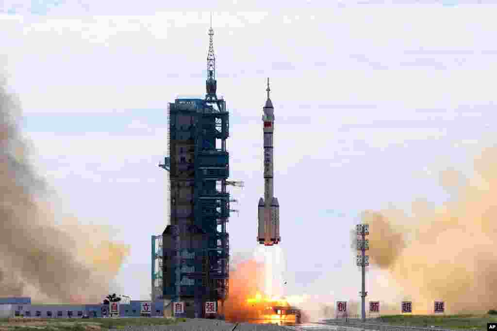 A Long March-2F Y12 rocket carrying a crew of Chinese astronauts in a Shenzhou-12 spaceship lifts off at the Jiuquan Satellite Launch Center in Jiuquan in northwestern China.