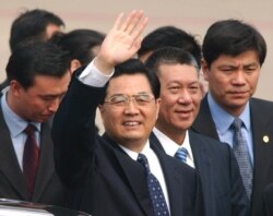 FILE - Chinese President Hu Jintao waves to well-wishers after arriving in Macau, Dec. 19, 2004.