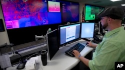 A specialist works at the National Cybersecurity and Communications Integration Center in Arlington, Virginia.