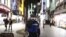 A police officer asks people to refrain from going out after 8 p.m. in the Shinjuku area of Tokyo on Jan. 8, 2021 during the first day under a state of emergency over the coronavirus pandemic. 