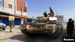 Troops from eastern Libyan forces are seen in Ain Zara, south of Tripoli, Libya, April 11, 2019. 