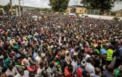 Malians supporting the recent overthrow of President Ibrahim Boubacar Keita gather to celebrate in the capital Bamako, Mali, Aug. 21, 2020.