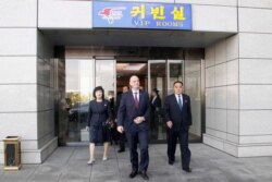 FIFA President Gianni Infantino, center, arrives at the Pyongyang Airport in Pyongyang, North Korea Tuesday, Oct. 15, 2019.