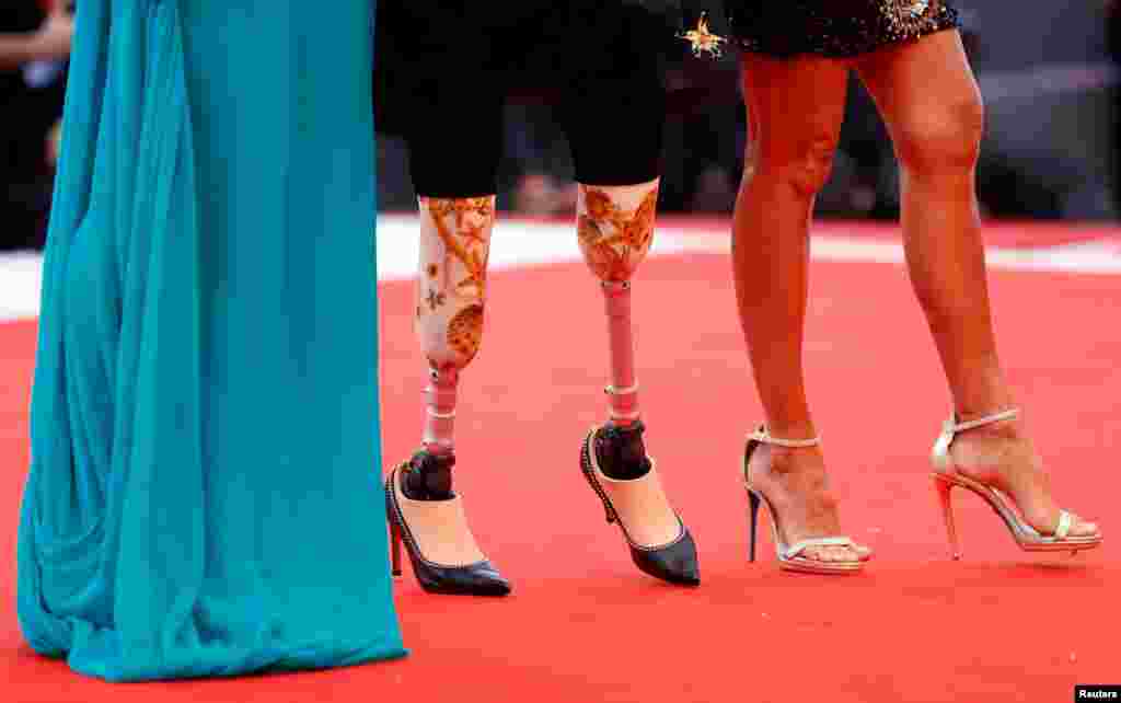 Guests arrive at the red carpet for the movie "The Truth" (La Verite) presented in competition at the 76th Venice Film Festival, in Venice, Italy, Aug. 28, 2019.