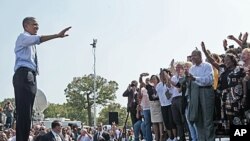 President Barack Obama waves to supporters after speaking at Fort Hayes Arts and Academic High School in Columbus, Ohio, September 13, 2011.