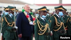 A guard of honor greets Belarus President Alexander Lukashenko at Robert Mugabe International airport in Harare, Zimbabwe Jan. 30, 2023. 