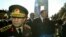 FILE - Turkish Prime Minister Tayyip Erdogan, flanked by Turkish Chief of Staff General Hilmi Ozkok (L) waves as they walk past the Turkish war memorial in Gallipoli, in western Turkey.