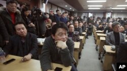 South Korean owners who run factories in the suspended inter-Korean Kaesong Industrial Complex, attend an emergency meeting held by the council of South Korean companies operating in the industrial park, in Seoul, South Korea, Friday, Feb. 12, 2016.