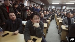 FILE - South Korean owners who run factories in the suspended inter-Korean Kaesong Industrial Complex, attend an emergency meeting held by the council of South Korean companies operating in the industrial park, in Seoul, South Korea, Feb. 12, 2016.