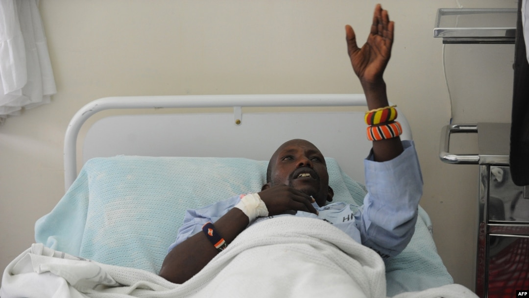 An injured Kenyan policeman lies on a hospital bed in Nairobi on November 11, 2012 recounting how he an others were attacked in Baragoi, Samburu North District.