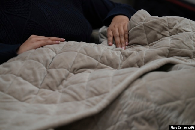 Weighted blankets provide comfort for some people who have trouble sleeping or with tension, stress or anxiety. (AP Photo/Mary Conlon)