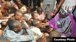 Dr. Hadiza Sabuwa Balarabe, acting governor of Kaduna state, inspects people rescued from a purported correctional facility in Zaria, at the Kaduna state headquarters of the Nigeria Security and Civil Defense Corps. (Kaduna state government photo)