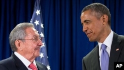 Cuban President Raul Castro, left, and U.S. President Barack Obama talk before a bilateral meeting at the United Nations headquarters in New York, Sept. 29, 2015.