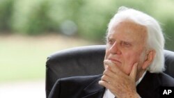 Billy Graham listens during a dedication ceremony for the Billy Graham Library in Charlotte, N.C., May 31, 2007.