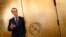 FILE - Germany's Bundesbank President Jens Weidmann stands beside the door of a giant safe at the money museum next to the Bundesbank headquarters, in Frankfurt, Germany, May 17, 2013.