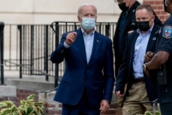 Democratic presidential candidate former Vice President Joe Biden speaks to member of the media as he leaves St. Joseph Catholic Church, Oct. 3, 2020, in Wilmington, Delaware.