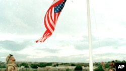 FILE - U.S. Marines raise the American flag over the reclaimed U.S. Embassy in Mogadishu.