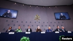 Members of the Pontifical Commission for the Protection of Minors hold a press conference on the release of the panel's first annual report, at the Vatican, Oct. 29, 2024.