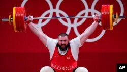 Lasha Talakhadze of Georgia competes in the men's +109kg weightlifting event, at the 2020 Summer Olympics in Tokyo, Japan, Aug. 4, 2021.