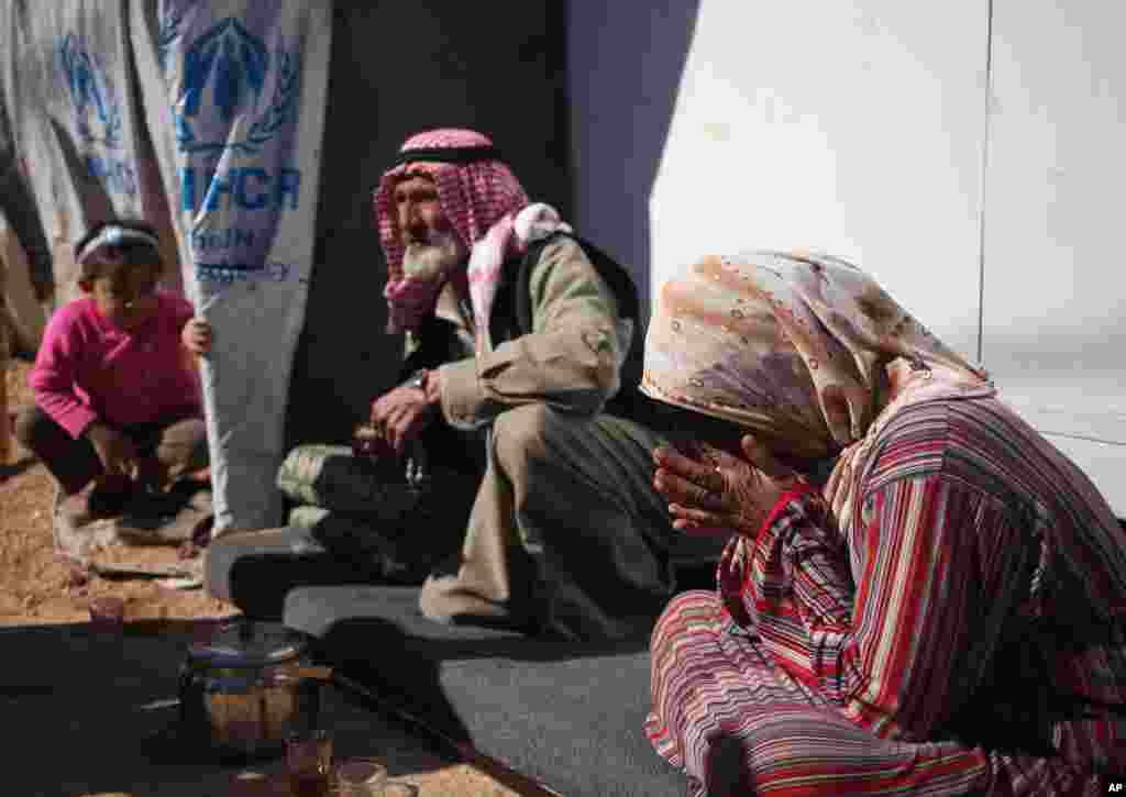 Syrian refugees from Deir al-Zour speak to a reporter in the Zaatari Refugee Camp near the Syrian border, in Mafraq, Jordan, Feb. 12, 2014. 