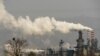 FILE - Smoke and steam rise from a coal processing plant in Hejin in central China's Shanxi Province, Nov. 28, 2019.