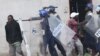 Armed Zimbabwean police clash with rioters in Harare, Monday, July 4, 2016. (AP Photo/Tsvangirayi Mukwazhi)