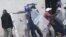 FILE: Armed Zimbabwean police clash with rioters in Harare, Monday, July 4, 2016. (AP Photo/Tsvangirayi Mukwazhi)