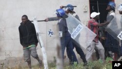 FILE: Police beating up people in Zimbabwe.