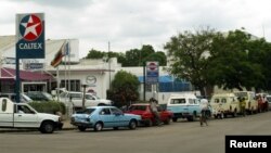 Zimbabwean drivers queue for petrol, in Bulawayo.