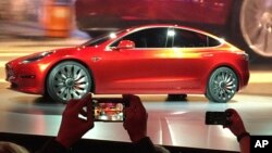 Tesla Motors unveils the new lower-priced Model 3 sedan at the Tesla Motors design studio in Hawthorne, California, March 31, 2016. Electric car maker Tesla said on Monday, July 3, 2017, that its Model 3 car will go on sale on Friday.