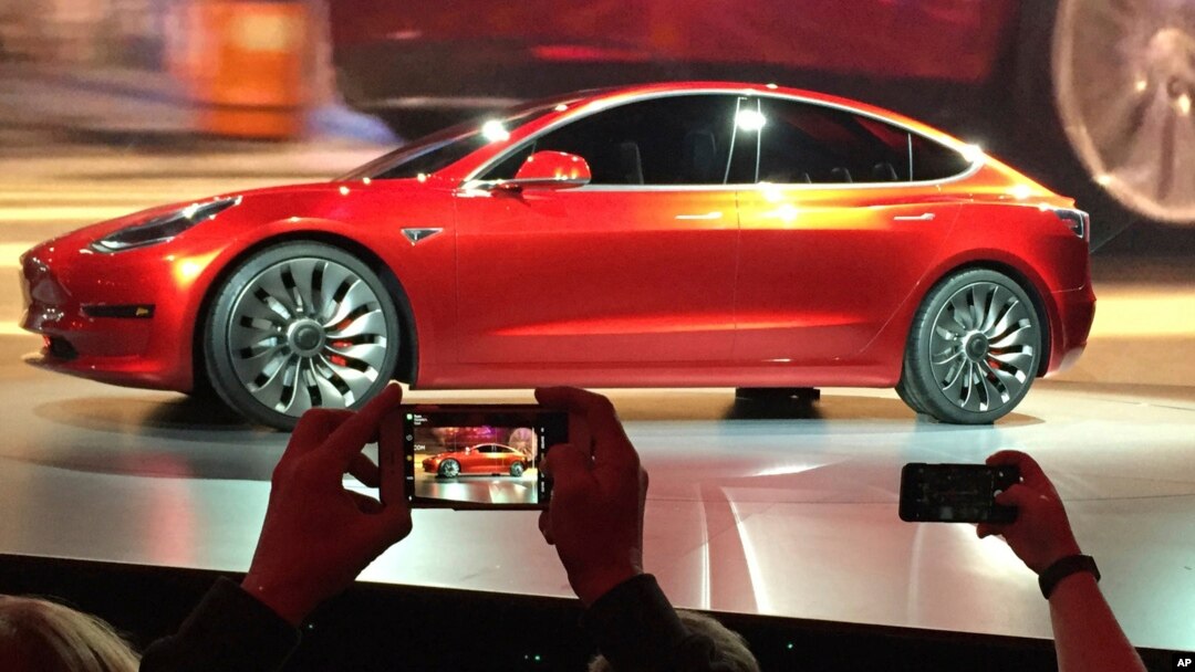 Tesla Motors unveils the new lower-priced Model 3 sedan at the Tesla Motors design studio in Hawthorne, California, March 31, 2016. Electric car maker Tesla said, July 3, 2017, that its Model 3 car will go on sale on Friday.