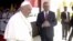 Iraqi Prime Minister Mustafa Al-Kadhimi welcomes Pope Francis at Baghdad International Airport to start his historic tour in Baghdad, Iraq, March 5, 2021.