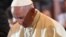 Pope Francis prays in the Wawel Cathedral in Krakow, Poland, July 27, 2016.