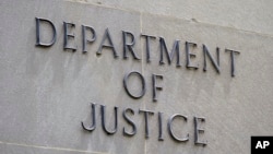 FILE - The outside of the Department of Justice building in Washington. A Russian internet propaganda campaign that spread disinformation in the U.S. and relied on artificial intelligence has been disrupted, the department said recently.