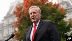 White House chief of staff Mark Meadows speaks with reporters at the White House, Oct. 21, 2020, in Washington. 