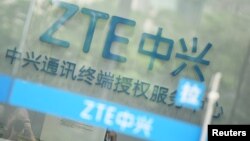 A sign of ZTE Corp is pictured at its service center in Hangzhou, Zhejiang province, China, May 14, 2018.